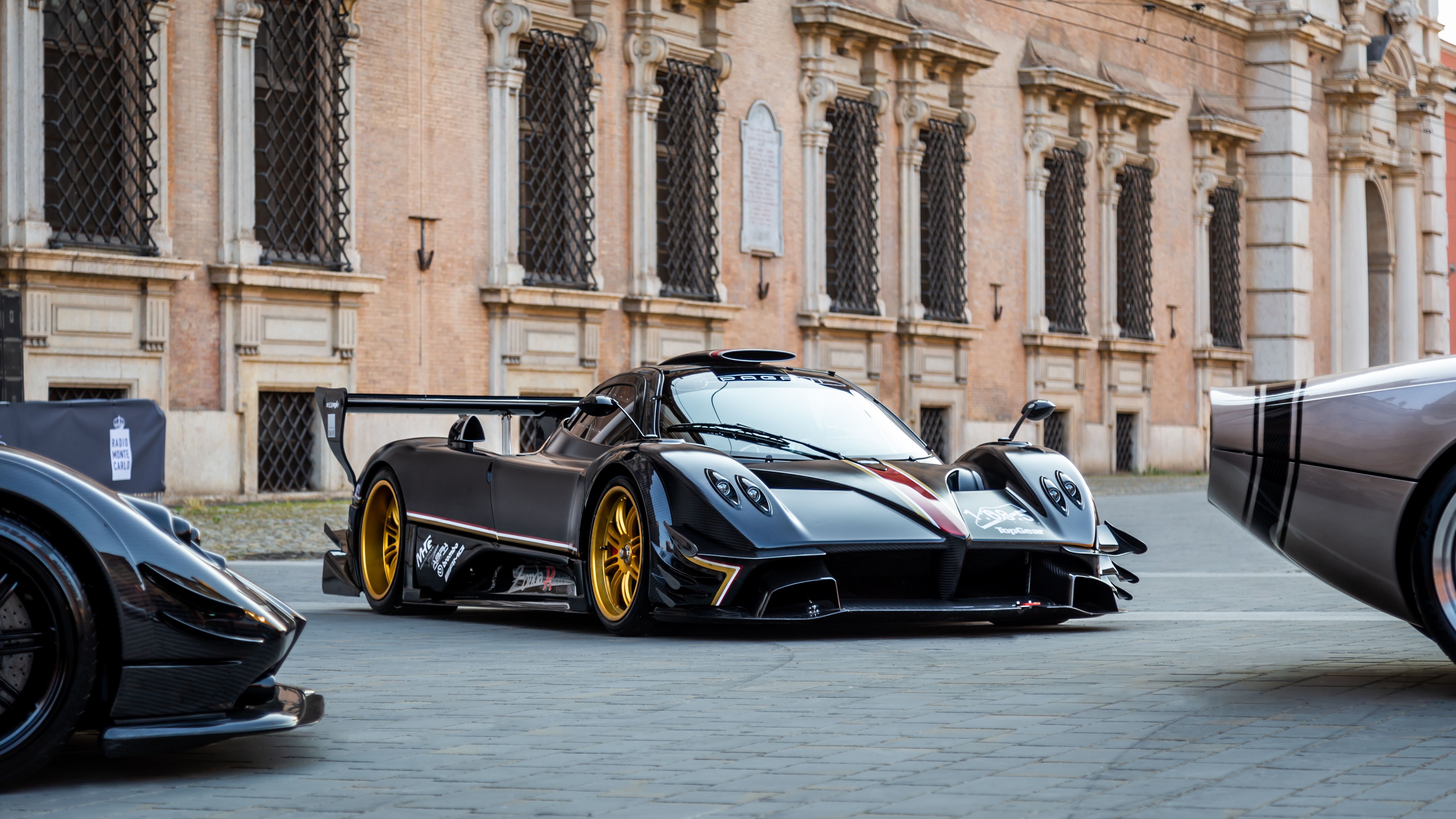 Pagani Zonda Revolución front view among other Paganis in a Modena square